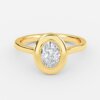bezel set oval diamond yellow gold rings