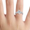 pear cut three stone engagement ring on hand