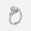 2 carat emerald cut engagement ring with three stone