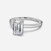 emerald cut diamond band with hidden halo engagement ring