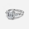 emerald cut with three stone engagement ring
