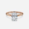 hidden accent oval stone engagement rings