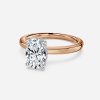 rose gold oval engagement ring with hidden halo