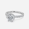 round cut solitaire engagement ring with hidden halo