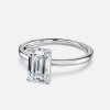 solitaire emerald cut white gold