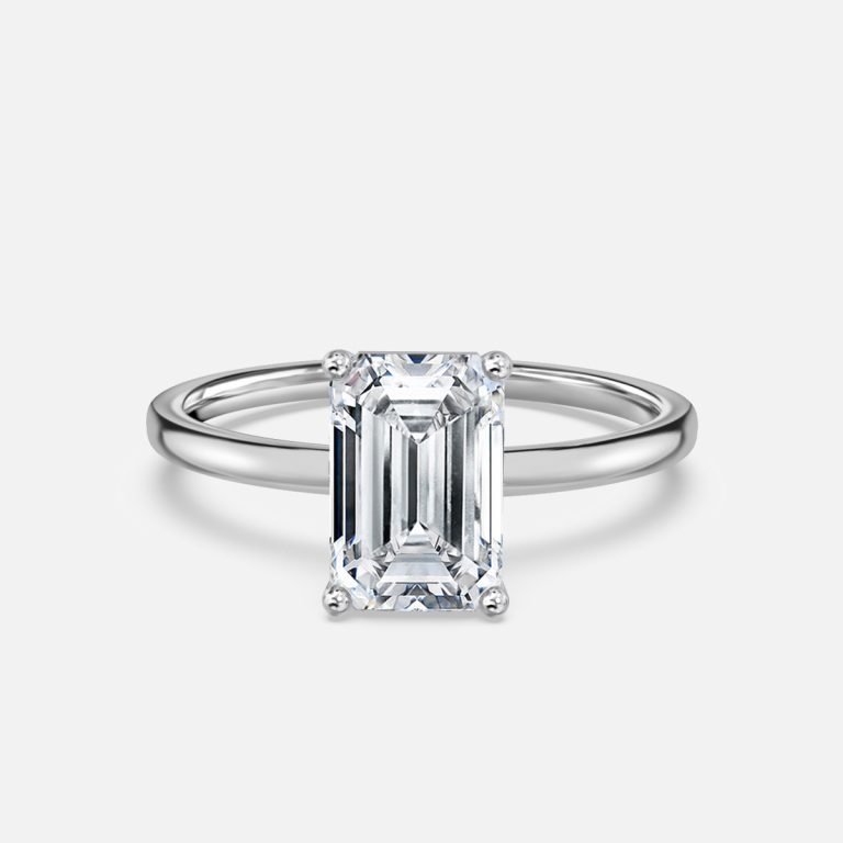 women emerald cut solitaire diamond ring
