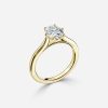 oval diamond cathedral set yellow gold ring