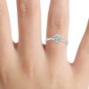 round cut diamond solitaire ring on finger