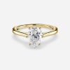cathedral set yellow gold pear diamond ring